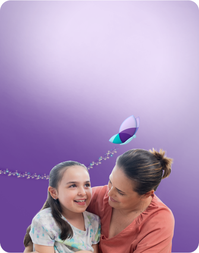 Clare, age 8, living with Rett syndrome, with her mom