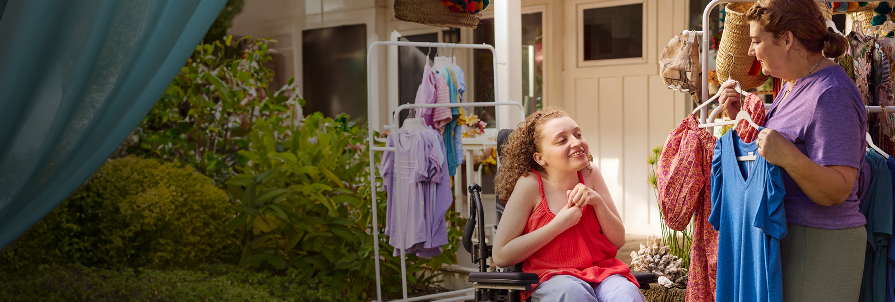 Maddy, age 20, living with Rett syndrome, with her mom. The light makes a circle around Maddy.